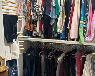 Closets full of men’s and women’s clothes 