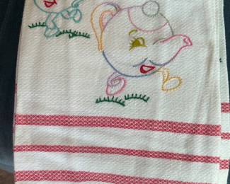 Lots of embroidery tea towels and sheet sets 