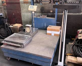 vintage platform scale with weights, smaller digital and manual table scales, mechanical beam scale