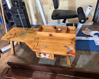 Antique Cobblers Bench with drawings on it