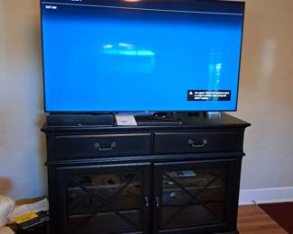 BIG SCREEN SMART TV,  DVD PLAYER, SOUND BAR SYSTEM, CONSOLE CHEST