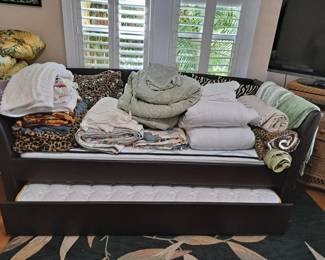 DAY BED WITH TRUNDLE INC. MATTRESSES, LOTS OF BED LINENS AND RUGS