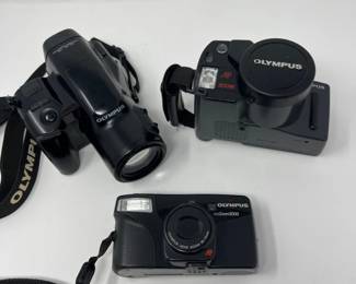 Olympus IS‑2, SuperZoom 300, and Zoom2000 Camera Trio	