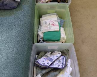 4 more bins like these in a closet with blankets and misc