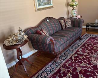 Formal sofa and end tables. Silver plated coffee/ tea service. Gone with the wind lamp.