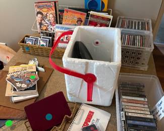 Media items… CDs, DVDs, records, cassette tapes, playing cards.