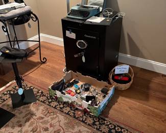 Speaker stands (2 available ), vintage typewriter, miscellaneouscords and plugs, pillows,  fireproof safe, reading glasses, iron bar height chairs (2 available )