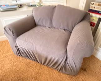 Oversized upholstered club chair with slipcover