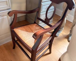 Dark wood dining armchair with upholstered seat