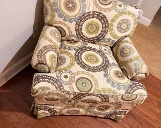 Upholstered slipper chair with medallion pattern fabric