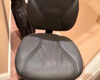 Black leather office desk chair on wheels