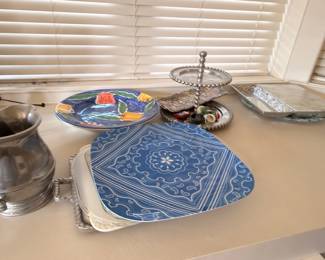 Blue and white decorative platters with silver tiered serving stand