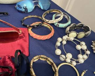 Coach sunglasses, bangle bracelets, pearl necklace, hoop earrings