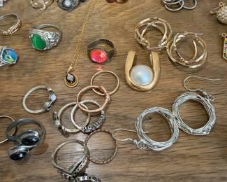 Mixed gold and silver rings with gemstones and pearls