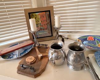 Pewter pitchers, framed landscape painting, and decorative accessories