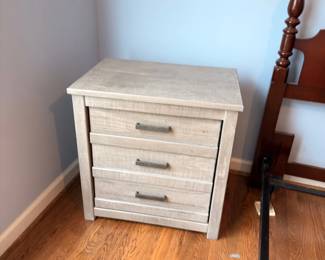 Rustic wood nightstand with iron hardware