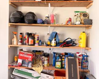 Garage shelving with tools, outdoor supplies, and hardware