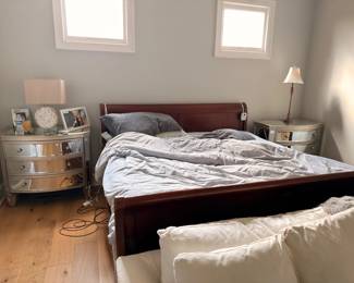 Queen bedroom set with dark wood bed frame and mirrored nightstand