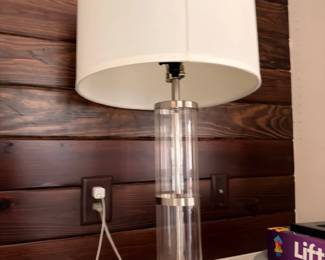 Glass and brushed nickel table lamp with drum shade