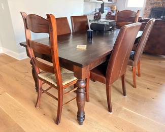 Dark wood dining table set with 6 upholstered chairs