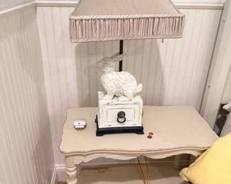 White painted nightstand with table lamp and figurine