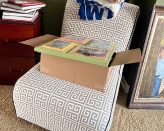 Upholstered storage ottoman with linens and towels