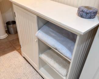 White bathroom vanity cabinet with open shelving