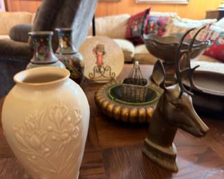 Ceramic vase, bronze deer figurine, snow globe, and collectibles