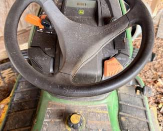John Deere riding mower, steering wheel and controls detail
