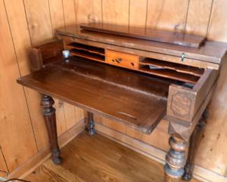 Antique spool-leg writing desk with drawer, carved details