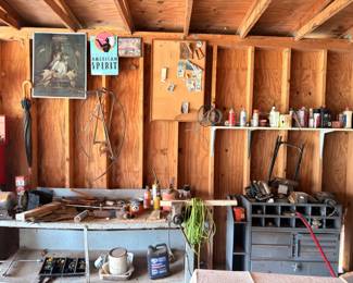 Workshop workbench with tools and supplies, barn setting
