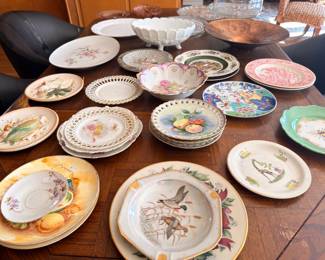 Assorted vintage decorative plates and platters, hand-painted
