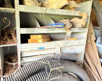 Garage shelving with hoses and supplies