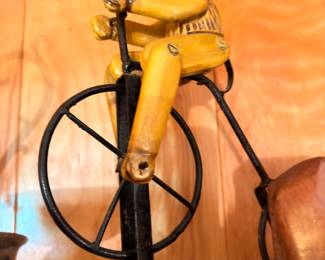 Vintage iron folk art cat on bicycle figurine