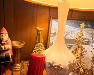 White ceramic table lamp, nutcracker, red pillar candle