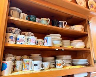 Assorted coffee mugs, cups, dishes, and kitchen dishware