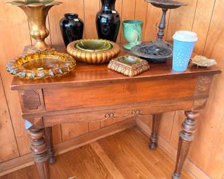 Antique turned-leg side table with brass candlesticks and decor