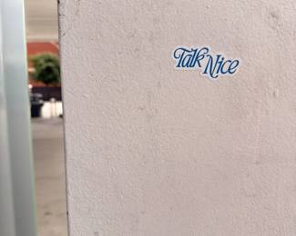 Talk Nice Nashville sign, neighborhood exterior
