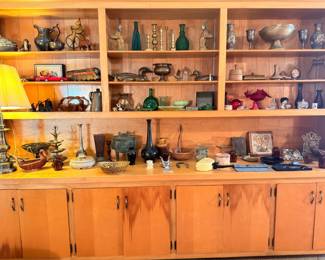 Vintage wooden hutch with collectible glassware and decor