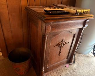 Antique carved wood nightstand with brass hardware
