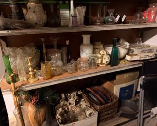 Vintage bottles, brass candlesticks, glassware, and collectibles