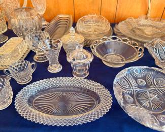 Pressed glass oval platter, covered dishes, and candleholders