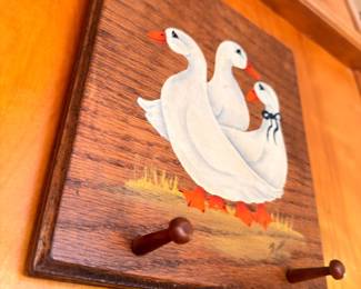 Wooden wall-mount paper towel holder with painted geese
