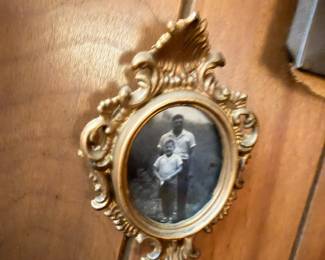 Ornate gold baroque oval picture frame, vintage photo