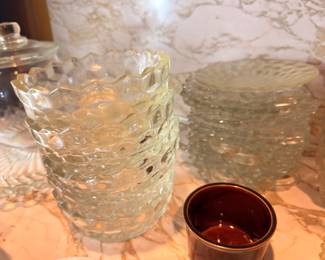 Textured glass pitcher and vintage pottery cup