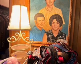 Framed portrait painting, table lamp, scarves and accessories