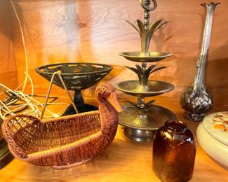 Brass tiered compote, wicker baskets, and pottery vase