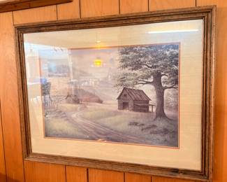 Framed cabin landscape painting