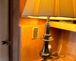 Brass candlestick table lamp with amber shade