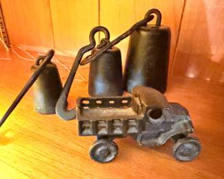 Antique cast iron bell toy cart on wheels